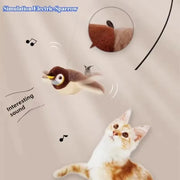 Plush Bird Cat Toy resembling an electric sparrow with a cat looking at it on a beige background