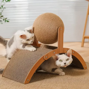 Two cats playing with a Cat Scratcher with Sisal Ball on a carpeted floor.