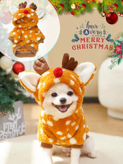 Dog wearing Christmas Reindeer Pet Costume with a 'Merry Christmas' sign in the background