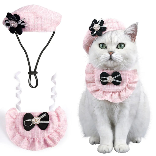 Cat wearing Elegant Cat Costume Set, sitting next to a matching headband and collar set.