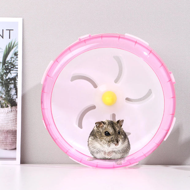 pink Hamster Exercise Wheel with a yellow center against a light gray background