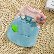 Cute Pet Overalls Dress Denim and Plaid Style, pink striped shirt, and flower accessory on a woven surface