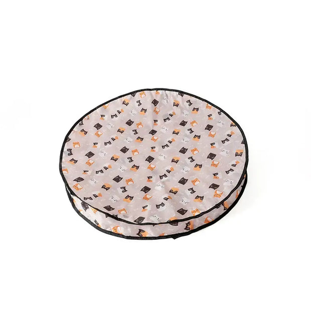 Round Interactive Cat Toy with Smart Obstacle Avoidance bed with black and orange pattern on a white background