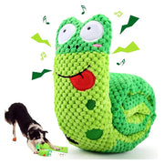 Green crocheted Plush Frog Dog Toy with a dog playing with it on a white background