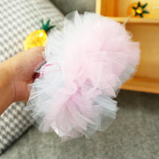 Pink Birthday Tutu Dress held by a hand with a blurred background