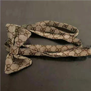 Luxury Pet Outfit Harness Vest And Dress Set Patterned shoelace on a dark surface