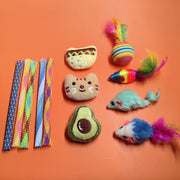 Assorted colorful Soft Plush Pet Sports Balls Toy Set on an orange background