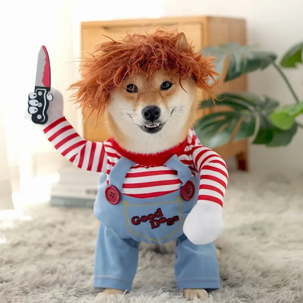 Dog wearing a Killer Doll Pet Costume with red hair, striped shirt, and overalls holding a knife.