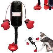 Cat Boxing Training Toy resembling a punching bag with red gloves and a black body, being played with by a cat.