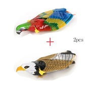 Two Electric Flying Bird Cat Toy, one colorful parrot and one bald eagle, on a white background with '2pcs' text.