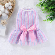 Summer Princess Dress with a pink bow on a textured surface with decorative elements.