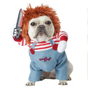 Dog wearing a Halloween Bat Skeleton Costume with red hair, striped shirt, blue overalls, and holding a knife.