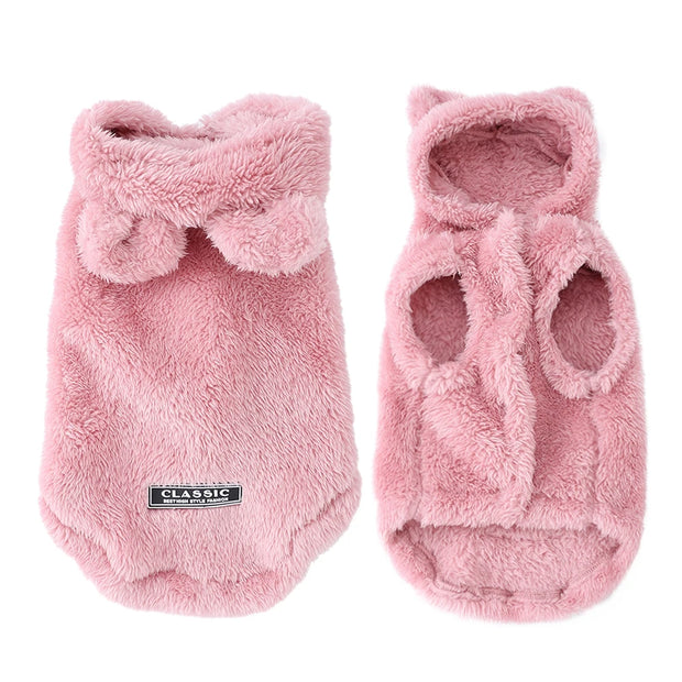 Two pink fuzzy Plush Winter Vest with a bow design on a white background