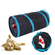 Black and blue Collapsible Cat Tunnel Toy with red balls, featuring a cat interacting with it on a white background.
