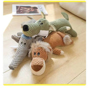 Three crocheted Plush Animal Dog Toys on a wooden floor.