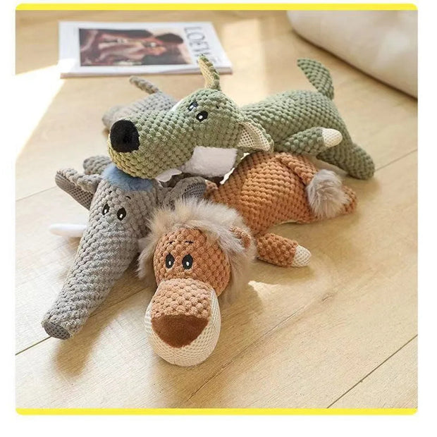 Three crocheted Plush Animal Dog Toys on a wooden floor.