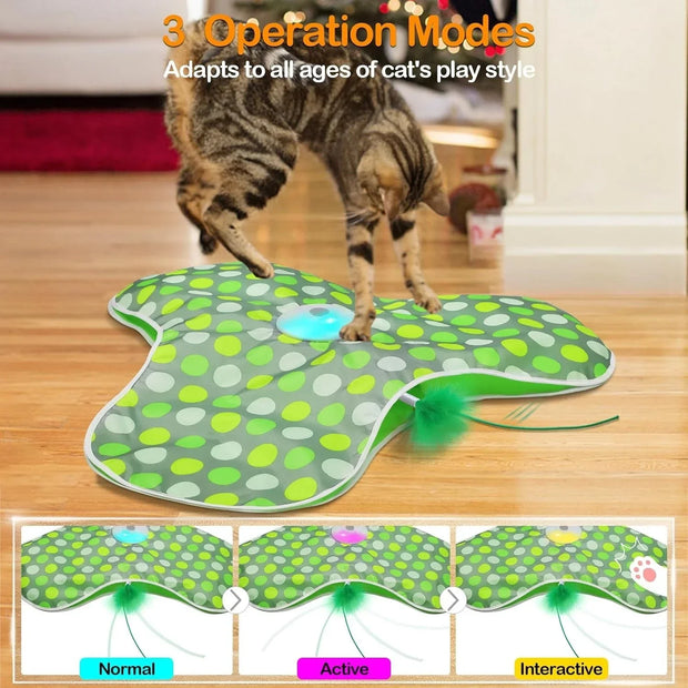 Cat playing with a green Hide and Seek Interactive Cat Toy Blanket on a wooden floor, with text about operation modes.