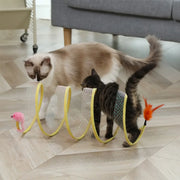 Two cats playing with a yellow Interactive Spiral Cat Toy Spring Tunnel with Plush Mouse on a wooden floor.