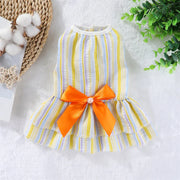 Summer Princess Dress with an orange bow on a white surface with decorative elements.