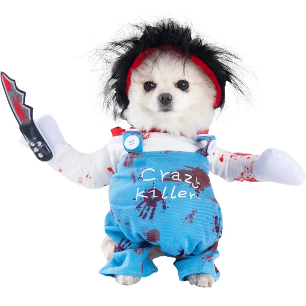 Dog in a Halloween Bat Skeleton Costume with blue overalls and red accents, holding a toy knife.