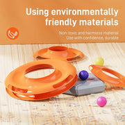 Orange Cat Turntable Toy track with colorful balls on a wooden surface, featuring text about environmentally friendly materials.