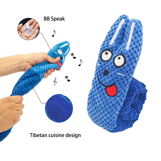 Blue Plush Frog Dog Toy with a face, labeled 'BB Speak' and 'Tibetan cuisine design', held by a hand.