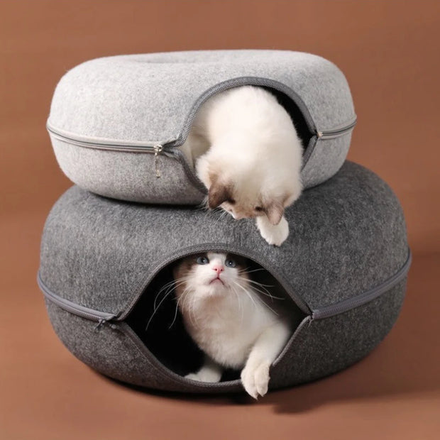 Two cats inside a stackable gray Felt Cat Cave Bed on a brown background
