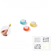 Colorful Pet Training Button circular stamps with a hand holding a stamp tool on a white background