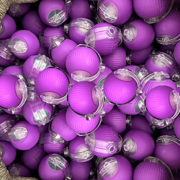Automatic Moving with LED Light Cat Toy Ball of purple spherical objects with clear stems against a blurred background
