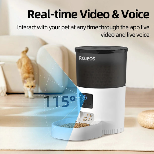 ROJECO Automatic Cat Feeder with Camera and Voice Recorder placed on a kitchen counter, displaying feeding schedule setup on a smartphone.