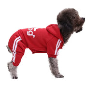 Dog wearing a red Sporty Pet Hoodie Jumpsuit with white stripes on a white background