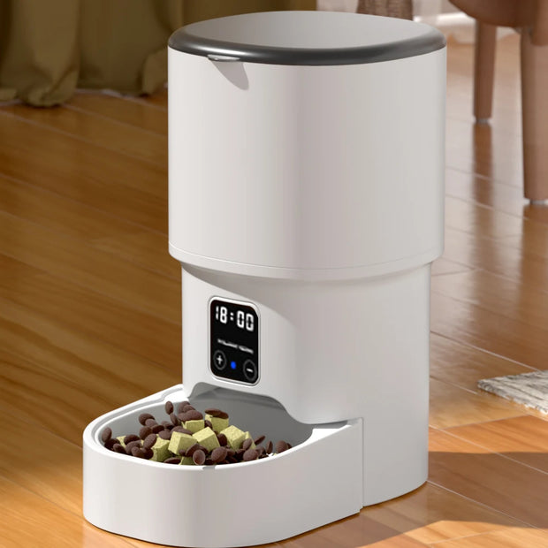 White electronic ZYFeeder Smart Automatic Pet Feeder with digital display on a wooden floor