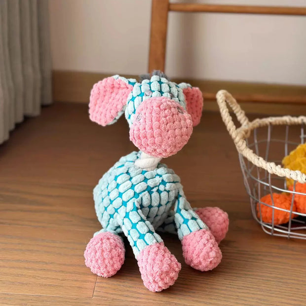 Knitted Plush Animal Rope Dog Toys with pink and blue pattern on a wooden floor