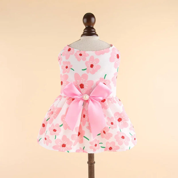 Summer Princess Dress with a large pink bow on a mannequin against a beige background