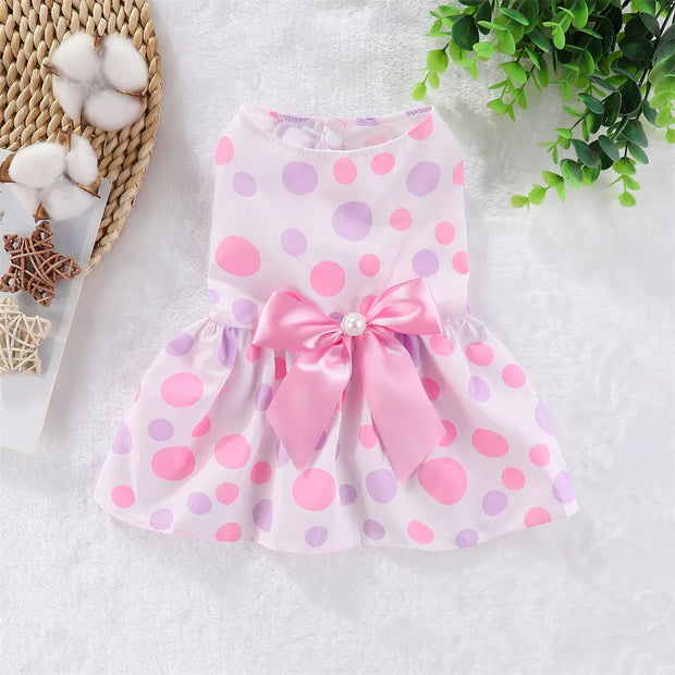 Pink and purple polka dot Summer Princess Dress with a bow on a white background