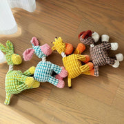 Colorful Plush Animal Rope Dog Toys on a wooden floor