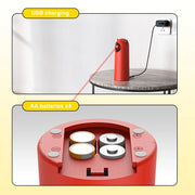 Red Little Devil Automatic Infrared LED Laser Cat Toy device being charged with USB cable and AA batteries visible