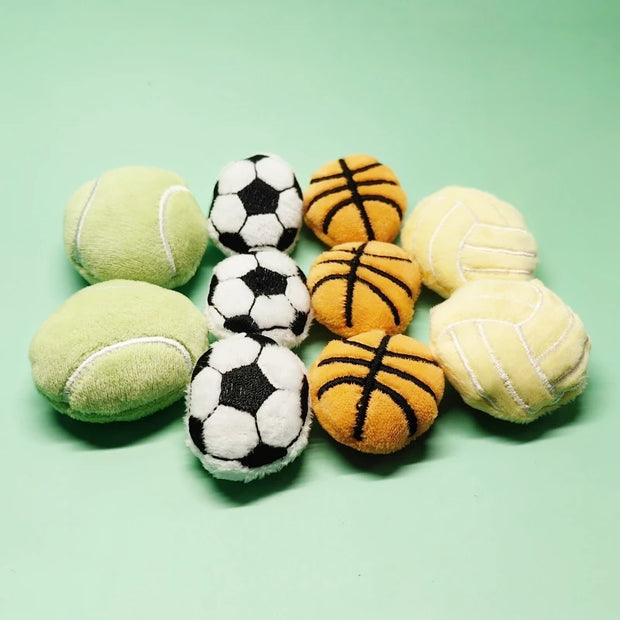 Collection of various Soft Plush Pet Sports Balls Toy Set on a light green background