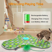 Cat playing with a green and gray polka dot Hide and Seek Interactive Cat Toy Blanket with a rechargeable battery indicator.