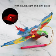 Colorful Electric Flying Bird Cat Toy with sound, light, and pink poles on a marble background