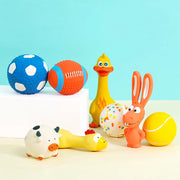 Colorful rubber duck, rabbit, and animal-shaped bath Durable Dog Sports Balls on a light blue background