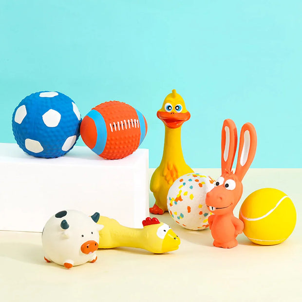 Colorful rubber duck, rabbit, and animal-shaped bath Durable Dog Sports Balls on a light blue background