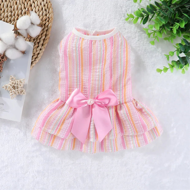 Pink and multicolored striped Summer Princess Dress with a bow on a white background