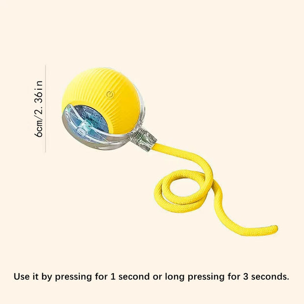 Yellow electronic Automatic Obstacle Avoidance Pet Toy Ball with a rope on a light pink background