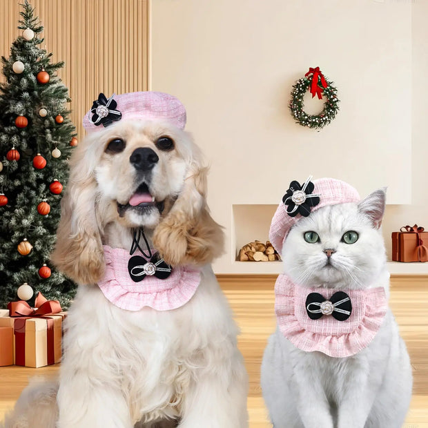 Two pet wearing pink Elegant Cat Costume Set in a festive room with Christmas tree and wreath.