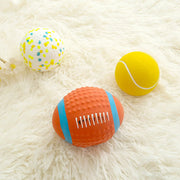 Three colorful Durable Dog Sports Balls on a fluffy white surface