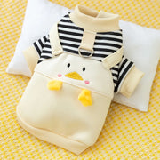 Duck Overalls Pet Outfit with striped shirt and cartoon duck design on a yellow textured background