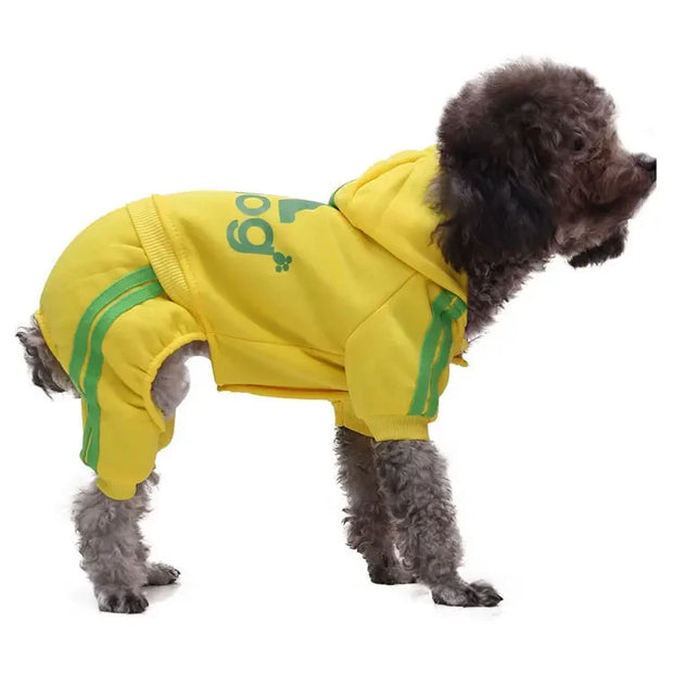 Dog wearing a yellow Sporty Pet Hoodie Jumpsuit with green accents on a white background