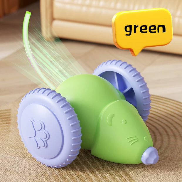 Green and purple Smart Interactive Cat Toy mouse with a water spray head on a wooden surface, labeled 'green'.