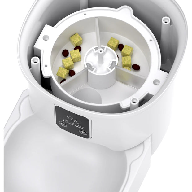 White ZYFeeder Smart Automatic Pet Feeder with compartments filled with dog treats on a white background